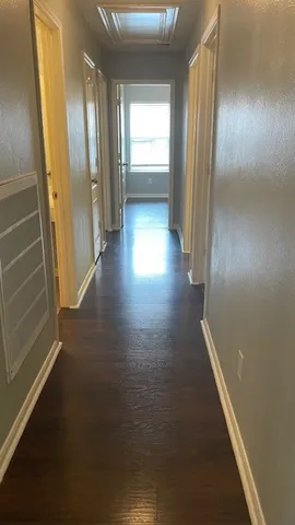 a view of room with window and wooden floor