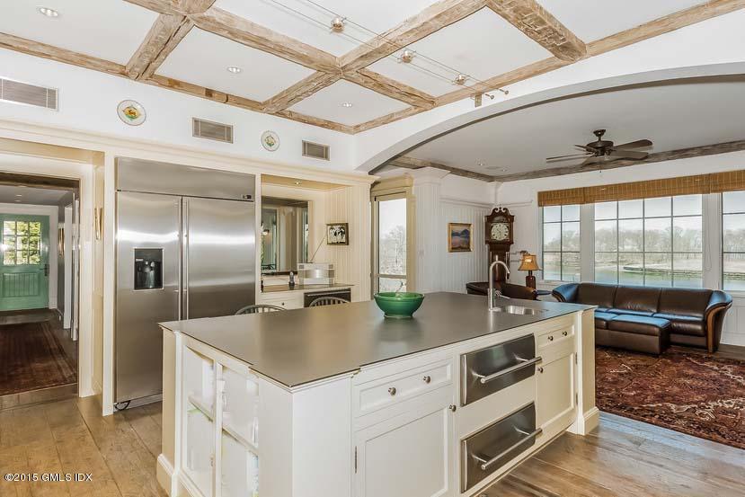 141 Long Neck Point Road Darien, CT 06820 - Photo 6 of 7 a kitchen with stainless steel appliances granite countertop a sink and a refrigerator