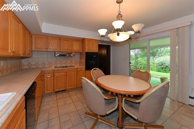 First view of kitchen with built in oven and walks out to patio