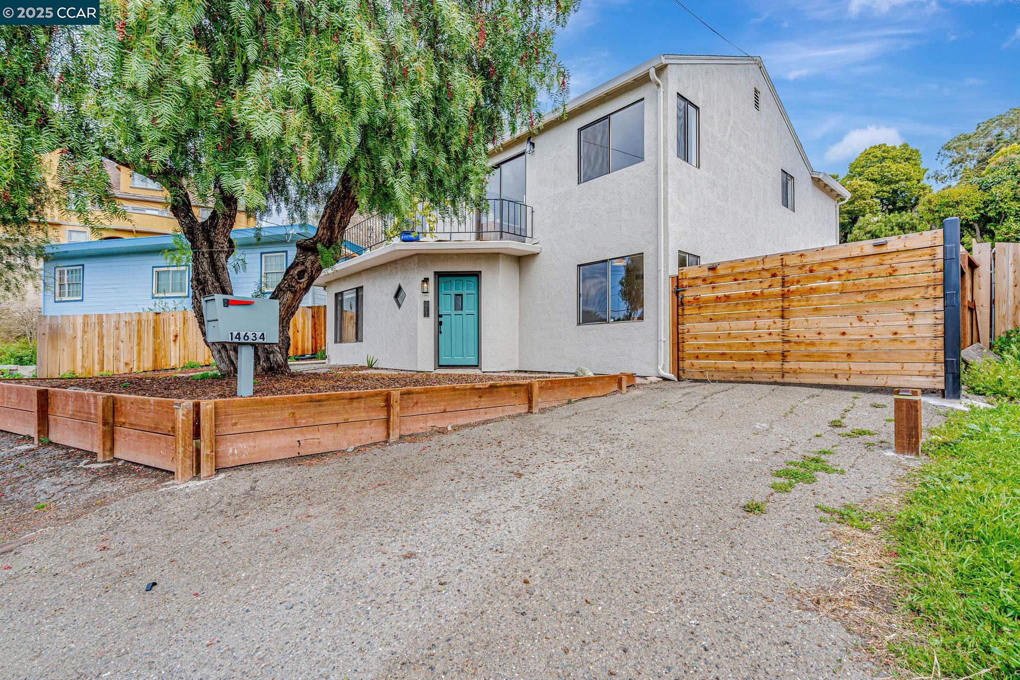 14634 Darius Way San Leandro, CA 94578 - Photo 1 of 1 a front view of a house with a yard and garage