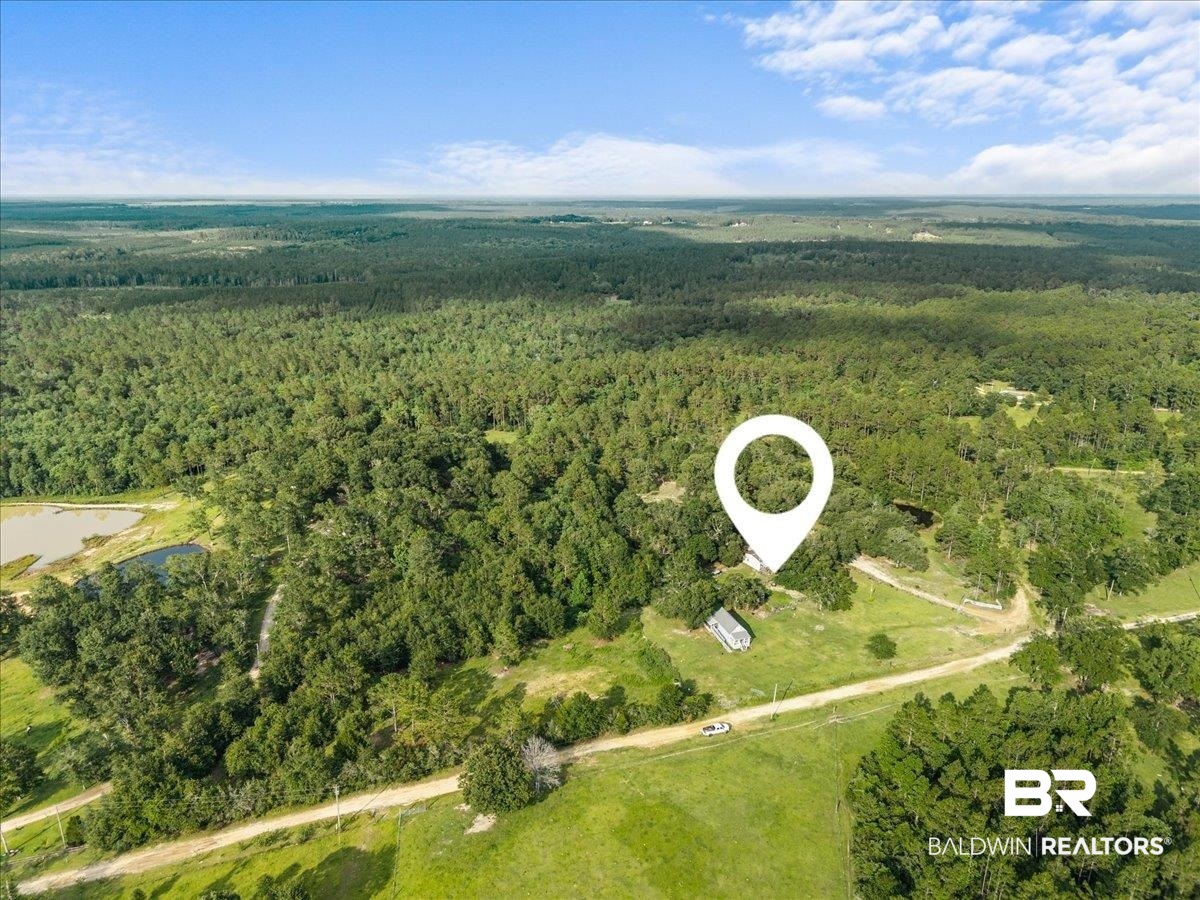 21011 River Road Robertsdale, AL 36567 - Photo 29 of 29 Expansive parcel with lush green fields and mature tree coverage