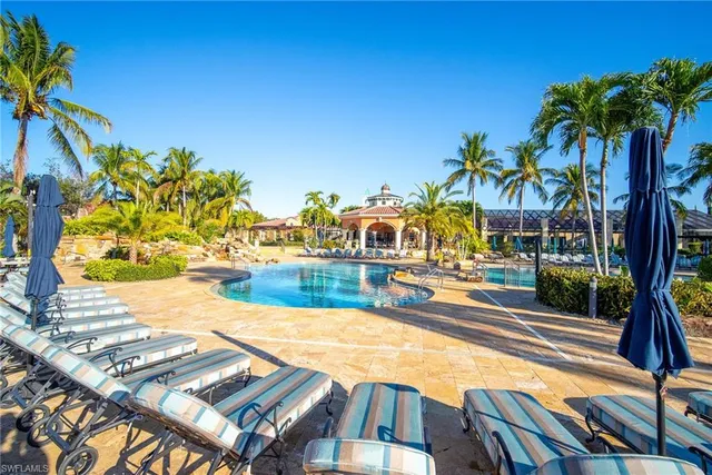 a view of a swimming pool with an outdoor seating