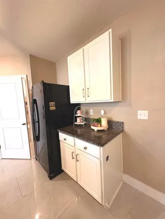 a bathroom with a toilet and a shower curtain