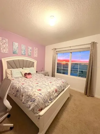 a room with gym equipment and view of living room