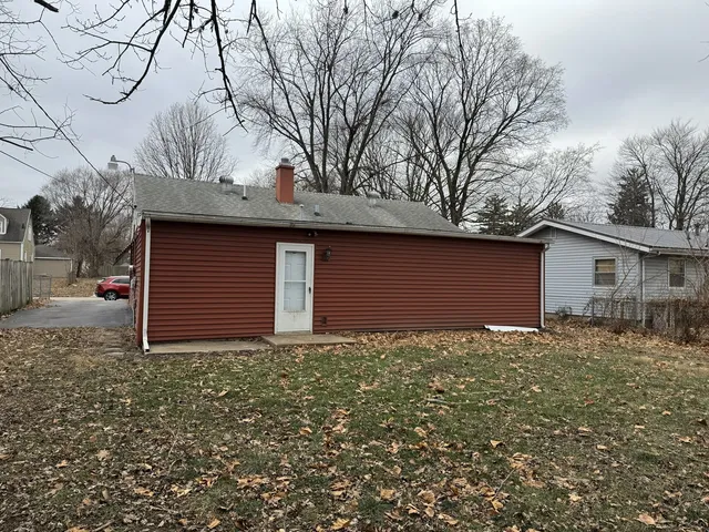 a backyard of house with large trees