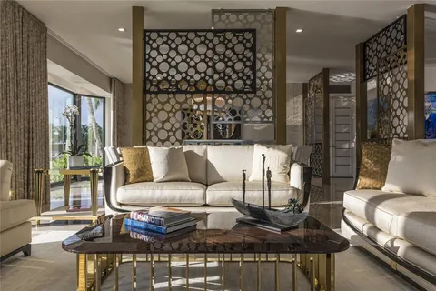 a dining room with furniture a chandelier and window