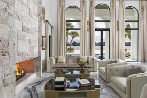 a living room with patio furniture and a window