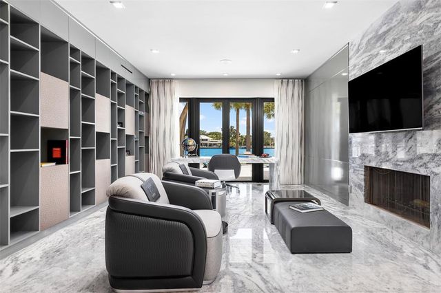 a large kitchen with a large counter top appliances and furniture