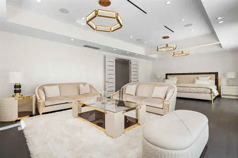 a spacious bedroom with a bed and large window