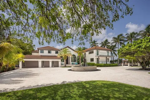 a view of swimming pool with a patio and a garden