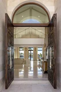 a view of open kitchen with wooden floor and a fireplace