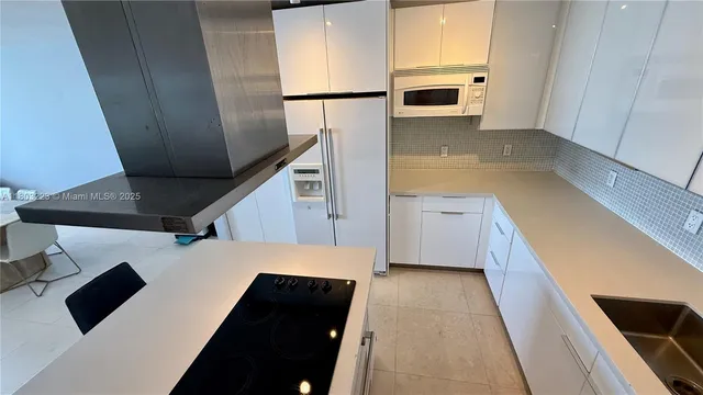 a view of a kitchen from the kitchen