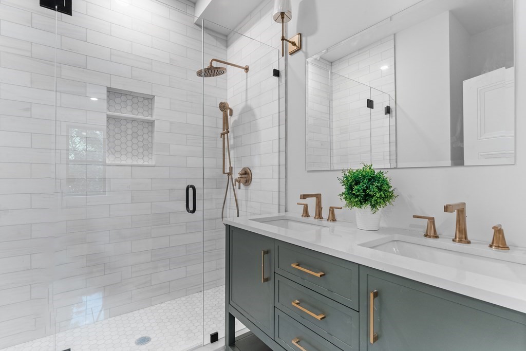 210 West Springfield Street, Unit 2 Boston, MA 02118 - Photo 19 of 33 a bathroom with a granite countertop sink a mirror a glass door and shower