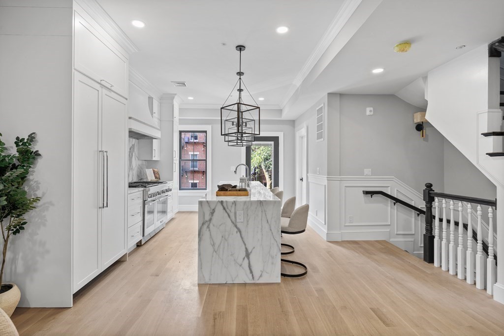 210 West Springfield Street, Unit 2 Boston, MA 02118 - Photo 2 of 33 a living room with furniture and a chandelier