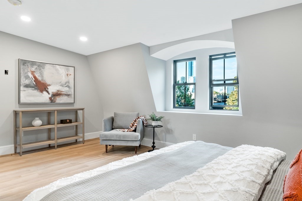 210 West Springfield Street, Unit 2 Boston, MA 02118 - Photo 21 of 33 a bedroom with a bed and wooden floor