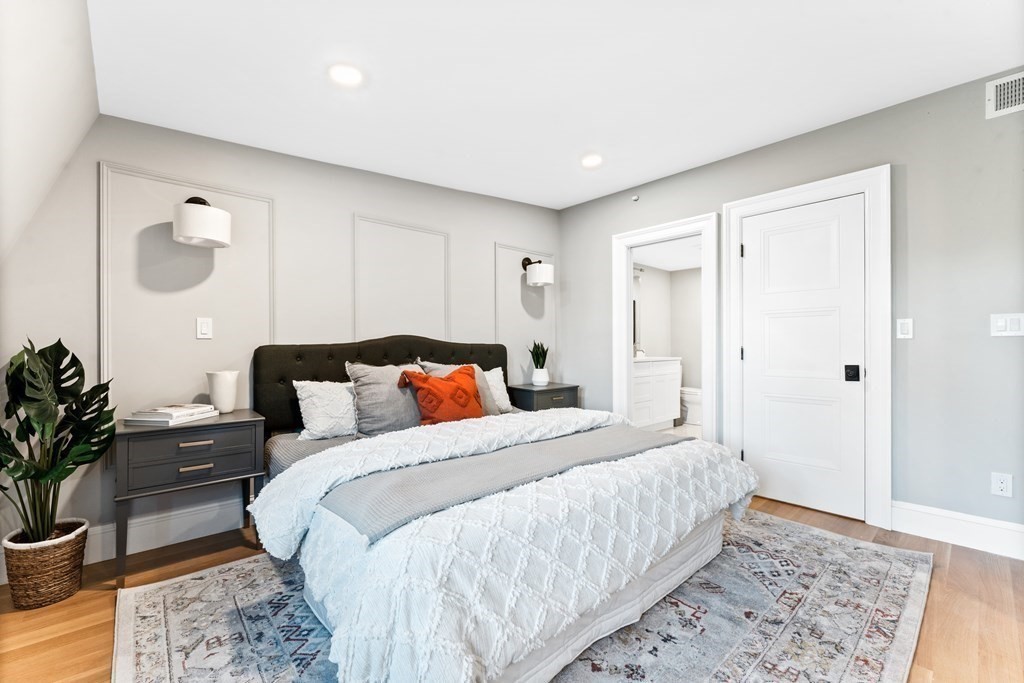 210 West Springfield Street, Unit 2 Boston, MA 02118 - Photo 23 of 33 a bed room with a bed and a potted plant