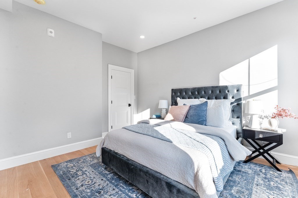 210 West Springfield Street, Unit 2 Boston, MA 02118 - Photo 27 of 33 a bed room with a bed and a lamp