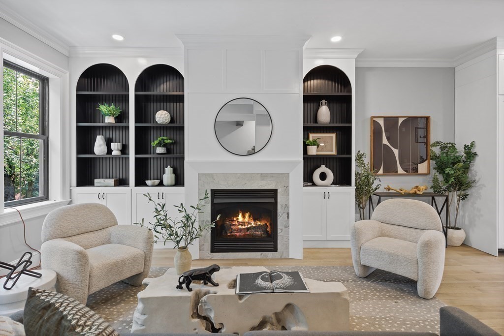 210 West Springfield Street, Unit 2 Boston, MA 02118 - Photo 4 of 33 a living room with furniture a fireplace and a large window