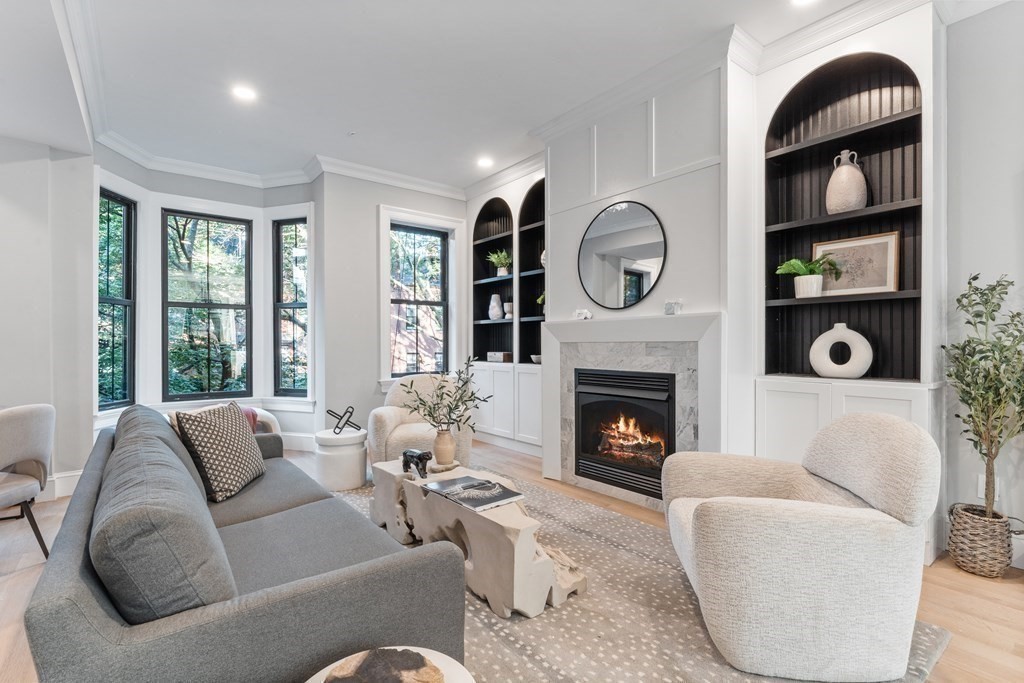 210 West Springfield Street, Unit 2 Boston, MA 02118 - Photo 6 of 33 a living room with furniture a fireplace and a large window