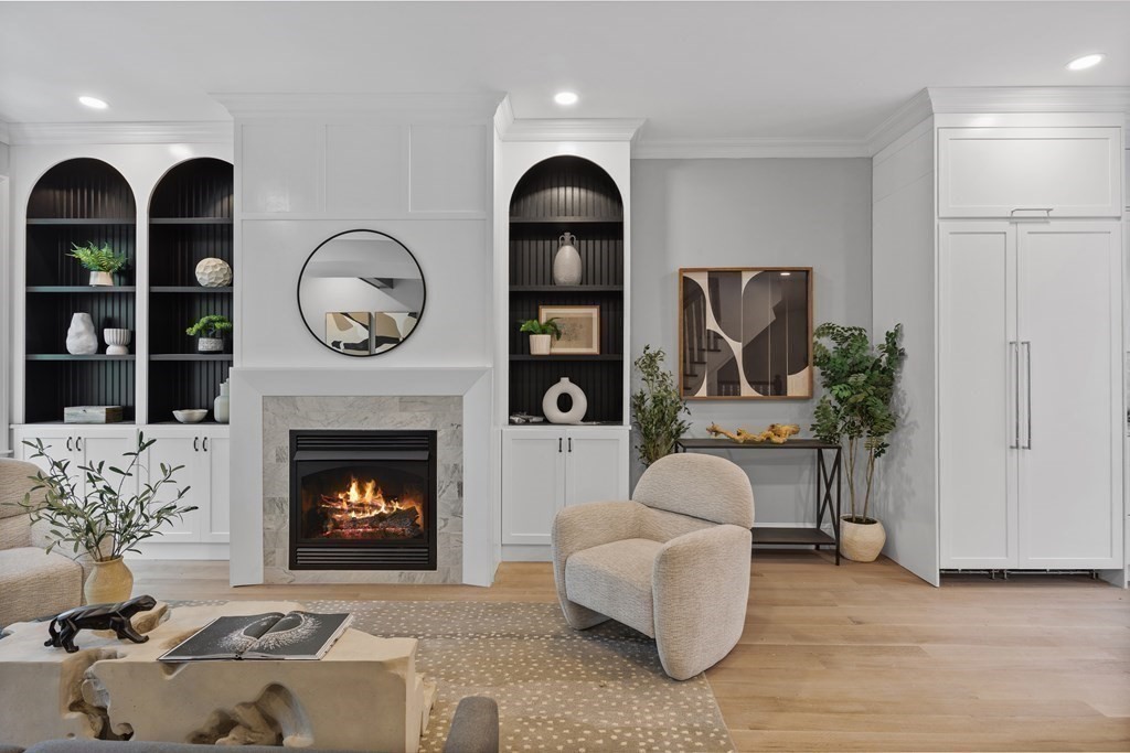 210 West Springfield Street, Unit 2 Boston, MA 02118 - Photo 8 of 33 a living room with furniture a clock and a fireplace