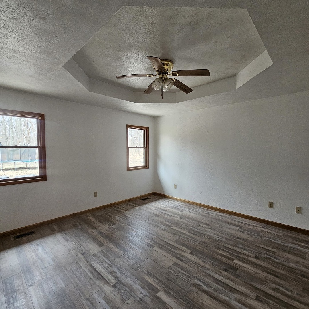 11211 Sam Pyle Bridge Road Benton, IL 62812 - Photo 6 of 11 a view of empty room with wooden floor and fan