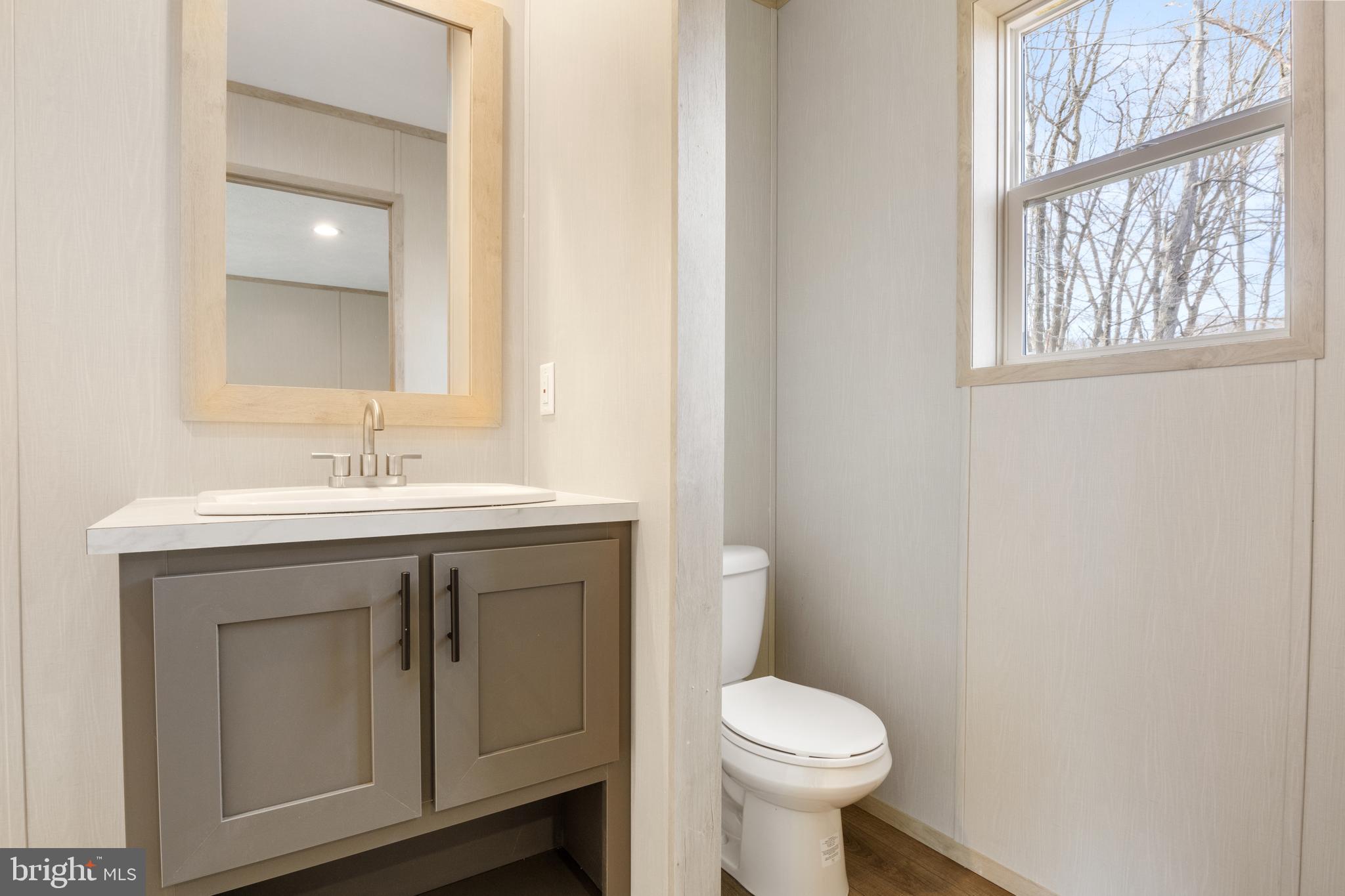 9 Mill Street York, PA 17406 - Photo 18 of 32 a bathroom with a sink toilet and a mirror