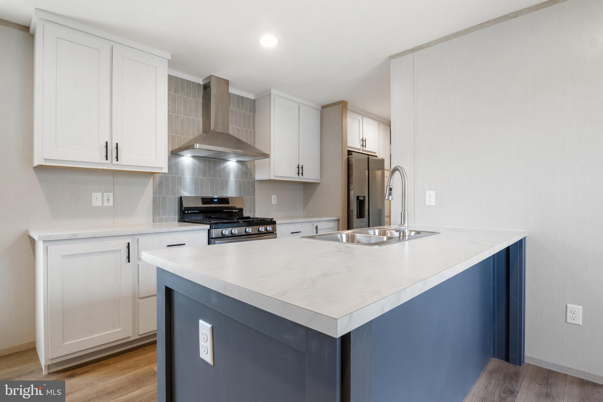 9 Mill Street York, PA 17406 - Photo 5 of 32 a kitchen with a appliances cabinets and a counter top space