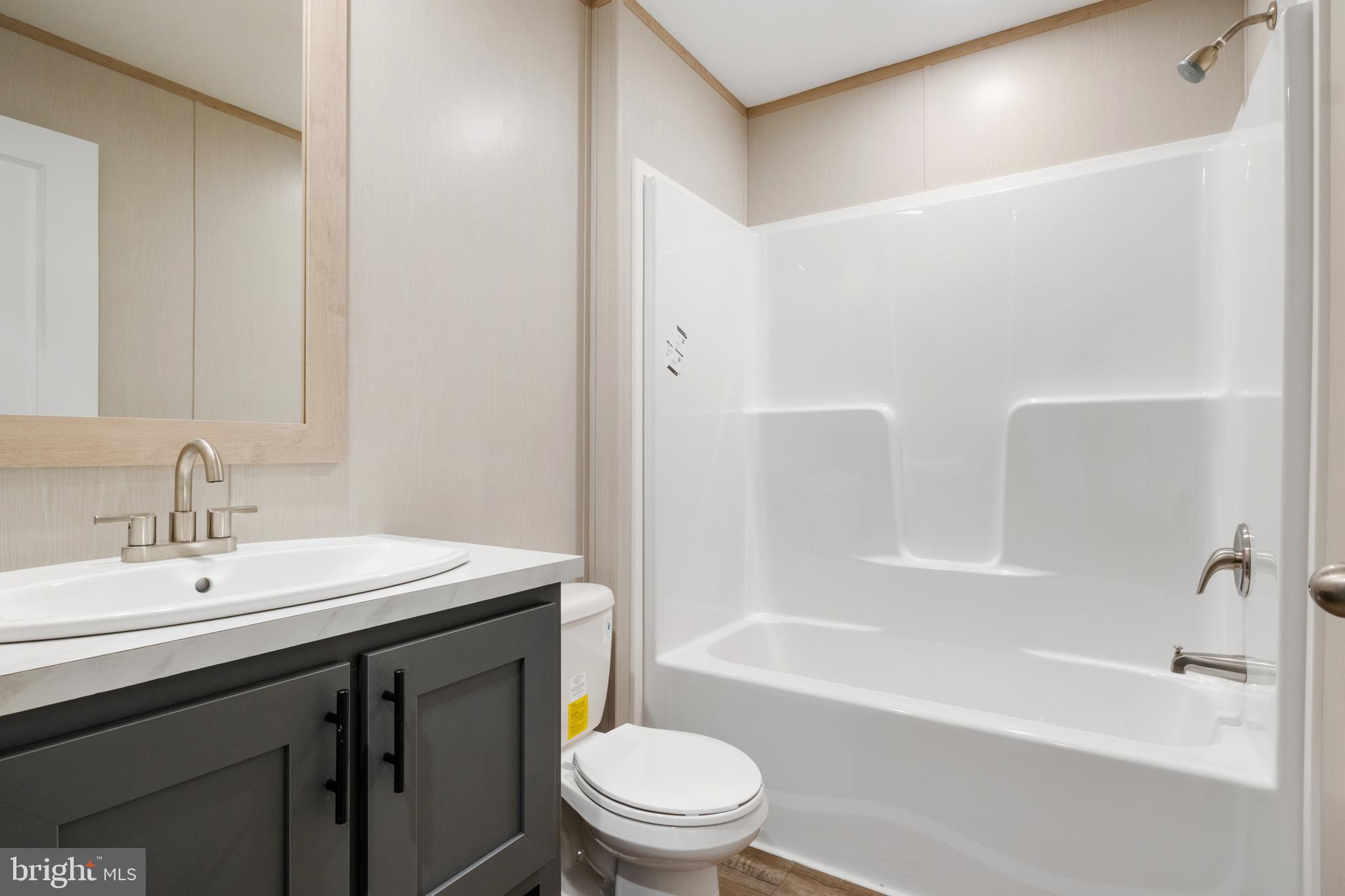 9 Mill Street York, PA 17406 - Photo 10 of 32 a bathroom with a sink a toilet and a bathtub