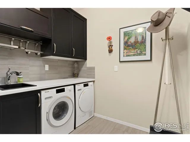 a view of a storage & utility room with a sink