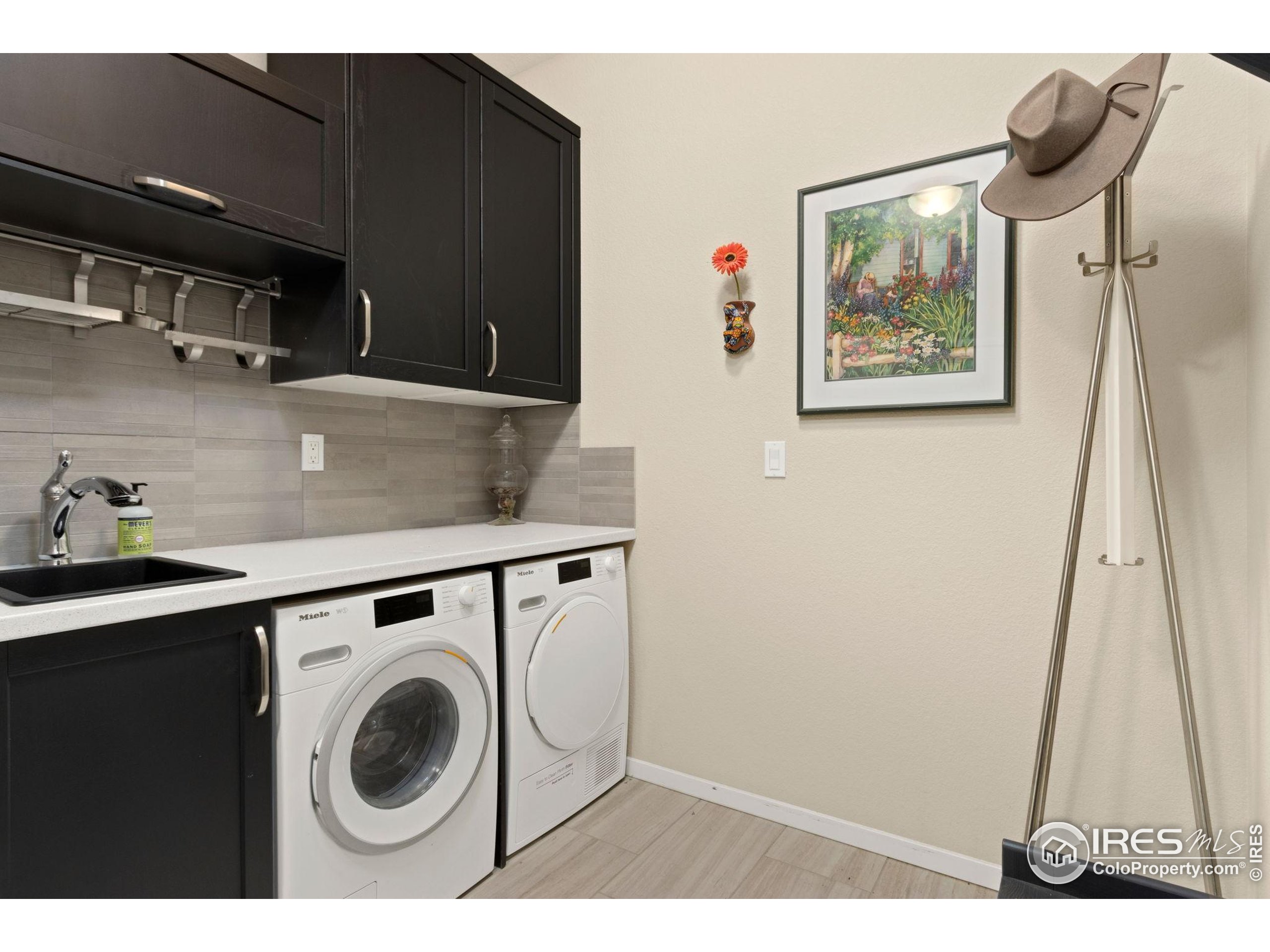 6808 Castello Street Timnath, CO 80547 - Photo 13 of 22 a view of a storage & utility room with a sink