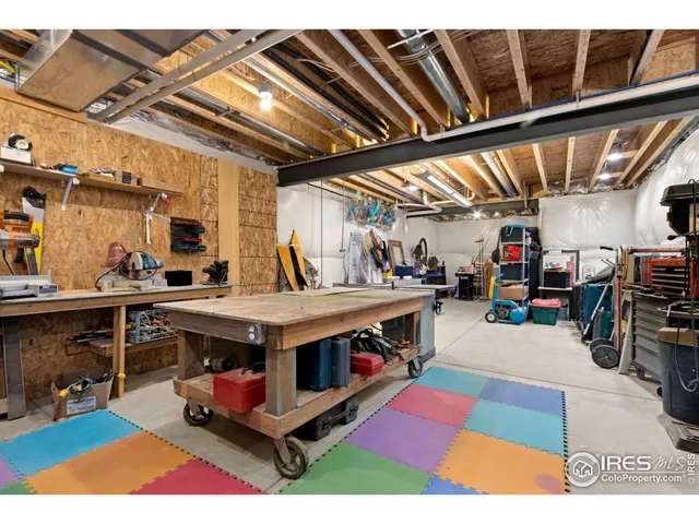 a view of a balcony with wooden benches