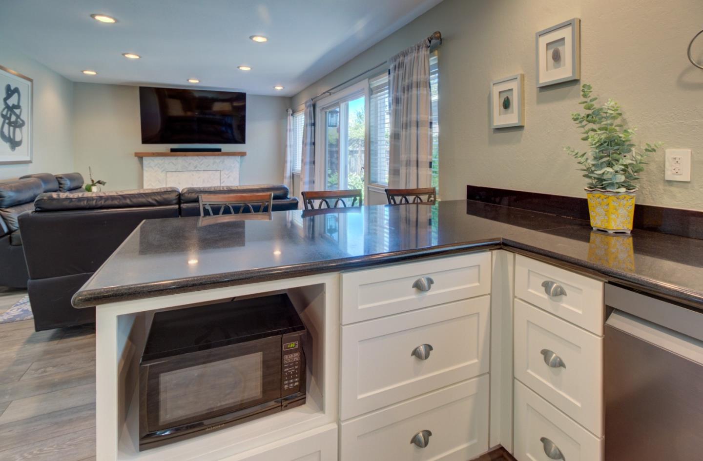 15120 Venetian Way Morgan Hill, CA 95037 - Photo 11 of 39 a kitchen with a sink stove and microwave