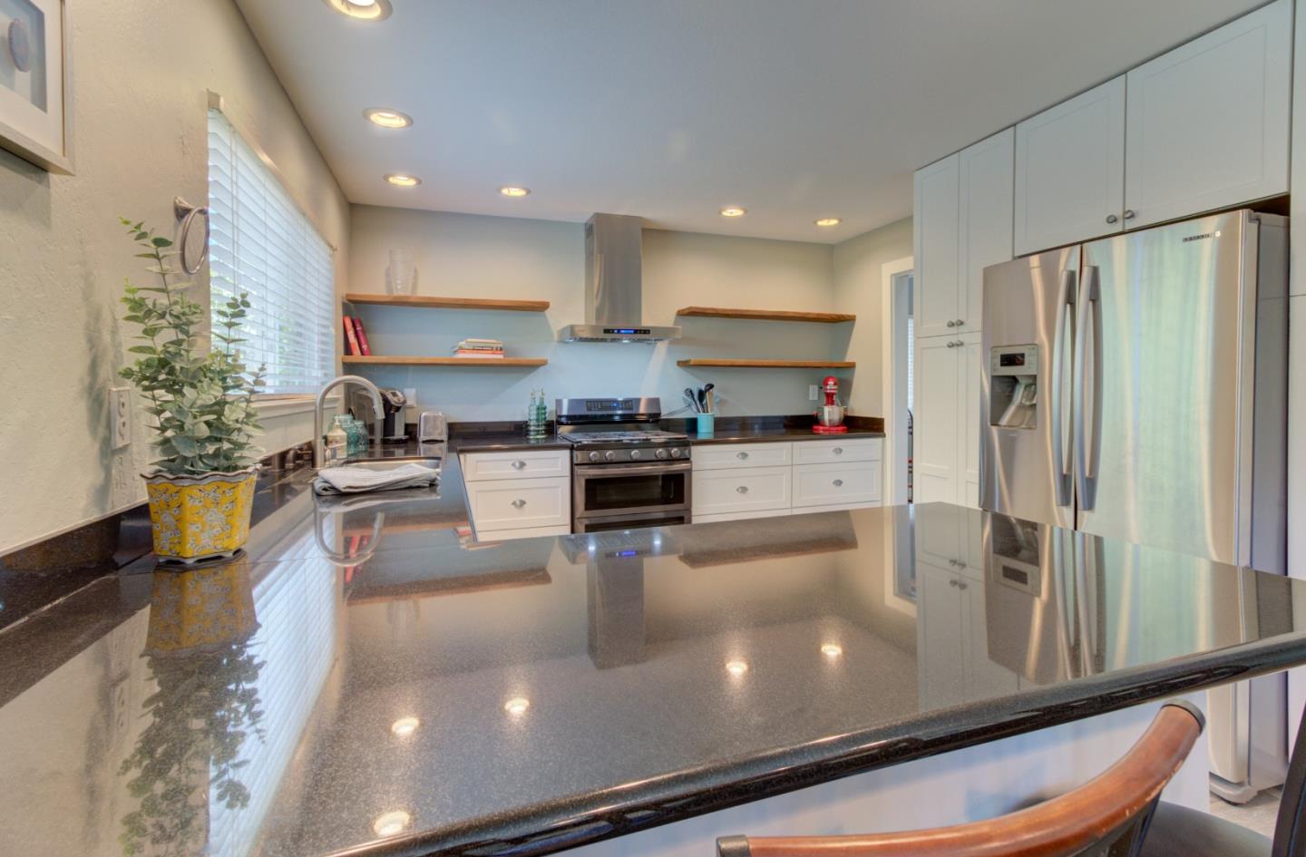 15120 Venetian Way Morgan Hill, CA 95037 - Photo 13 of 39 a kitchen with stainless steel appliances granite countertop a refrigerator a stove and a sink