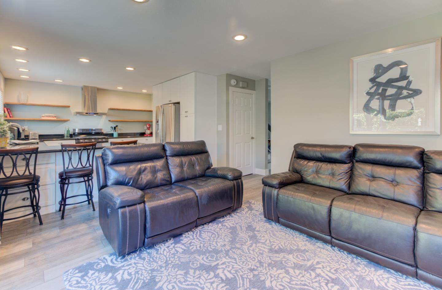 15120 Venetian Way Morgan Hill, CA 95037 - Photo 14 of 39 a living room with a couch and cabinets