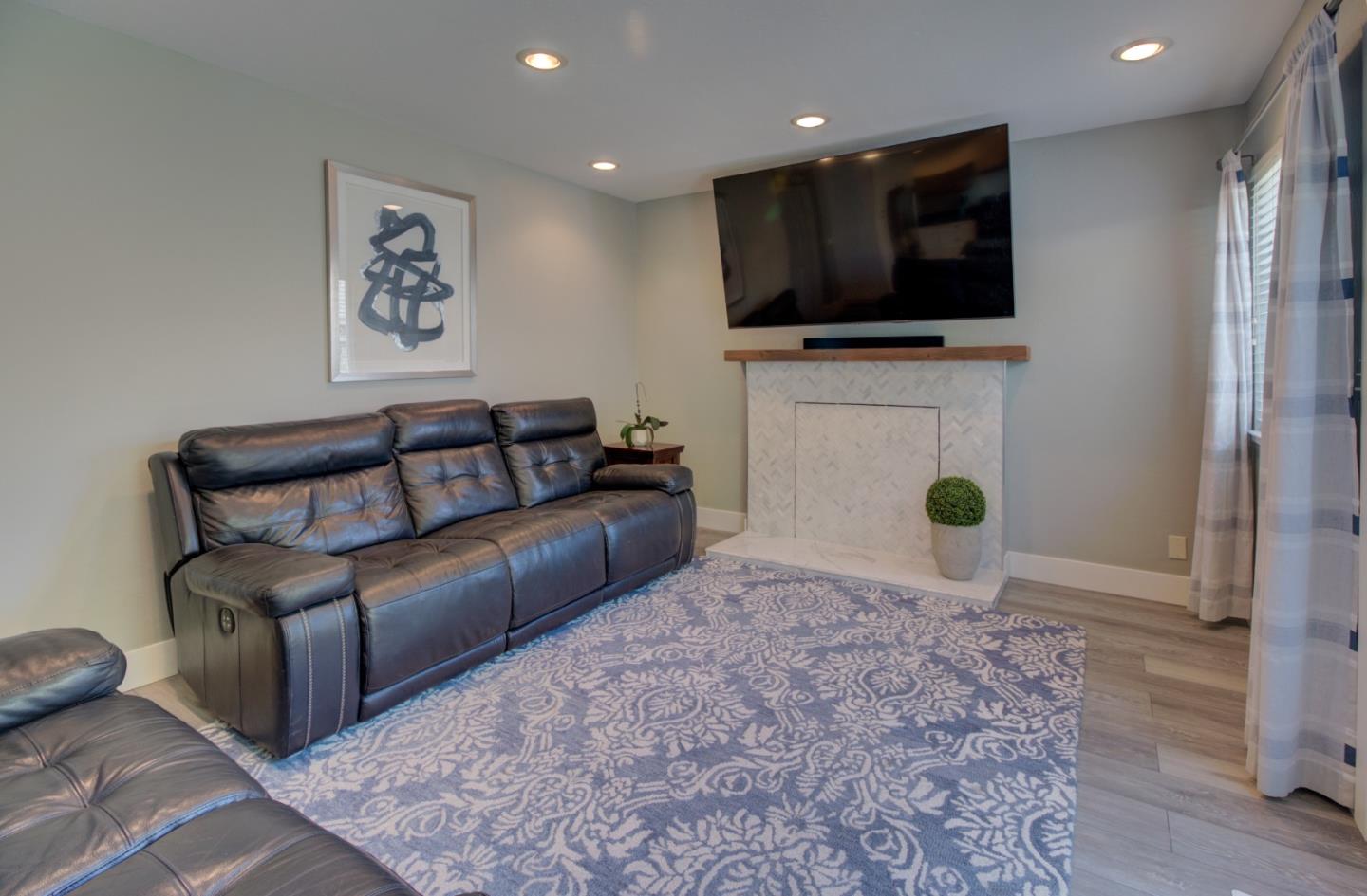 15120 Venetian Way Morgan Hill, CA 95037 - Photo 15 of 39 a living room with furniture and a flat screen tv