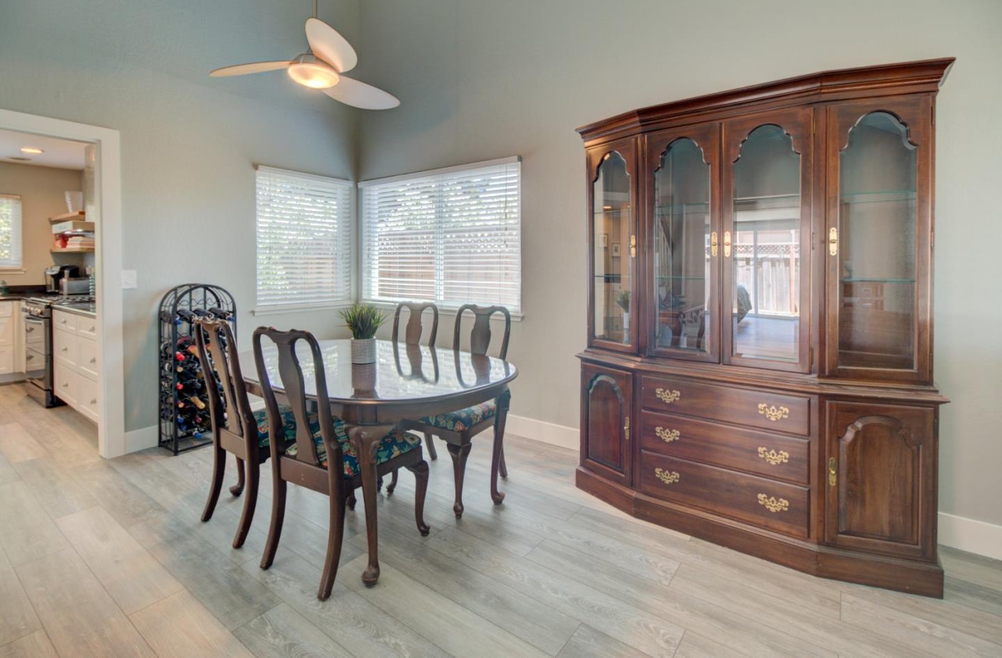 15120 Venetian Way Morgan Hill, CA 95037 - Photo 17 of 39 a dining room with furniture a chandelier and wooden floor