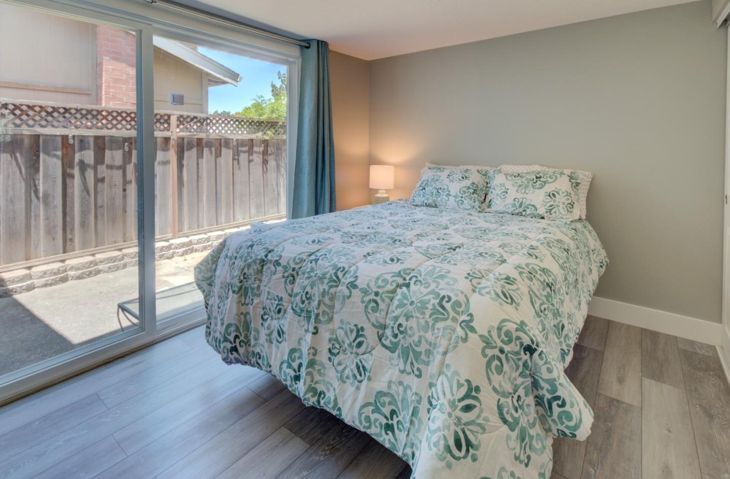 15120 Venetian Way Morgan Hill, CA 95037 - Photo 21 of 39 a bed sitting in a bedroom next to a window