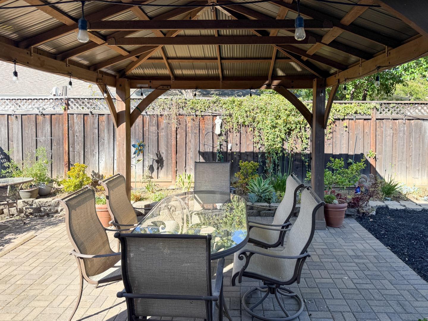 15120 Venetian Way Morgan Hill, CA 95037 - Photo 37 of 39 a patio with yard table and chairs