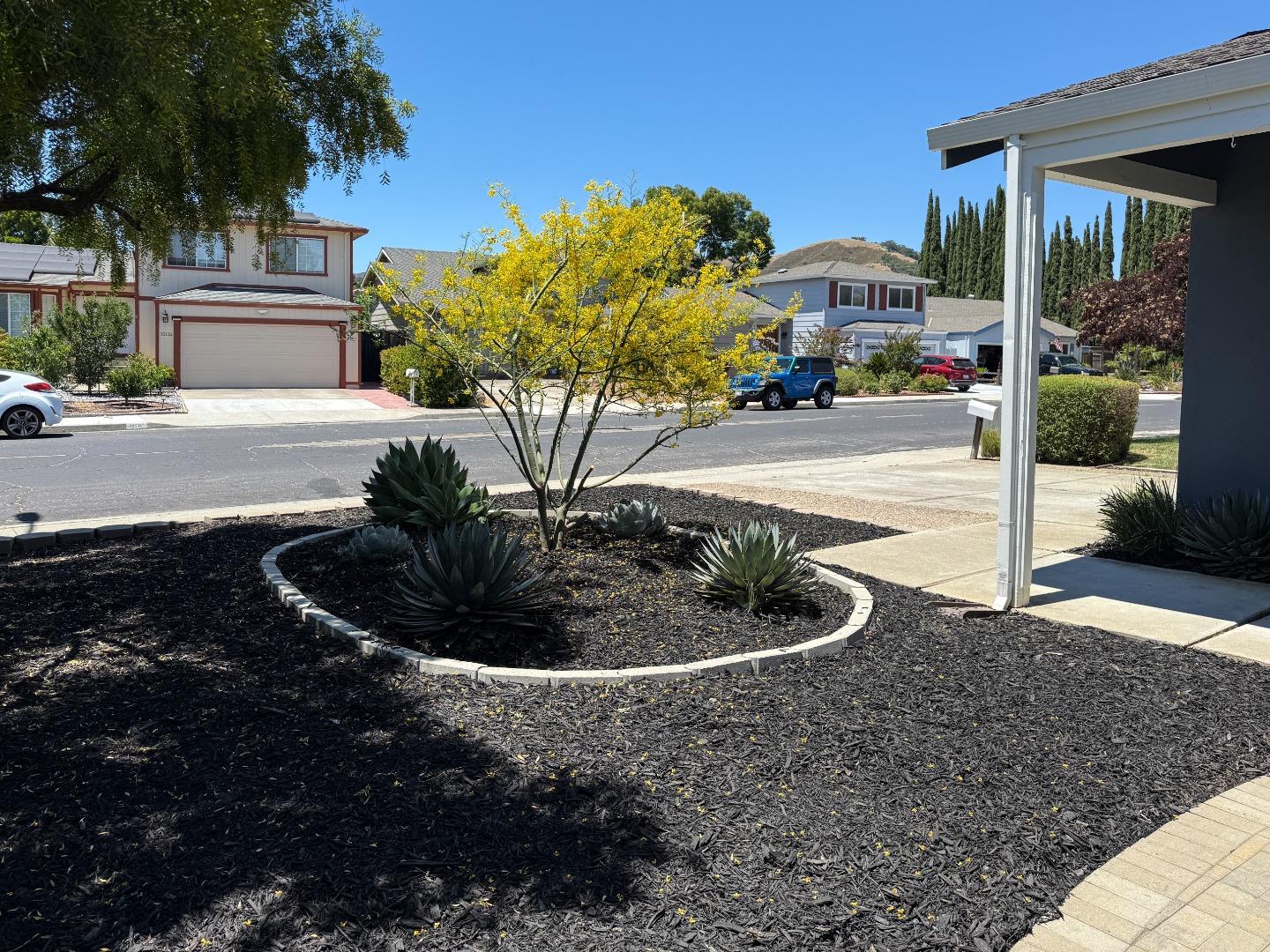 15120 Venetian Way Morgan Hill, CA 95037 - Photo 6 of 39 a view of a water fountain in front of a house