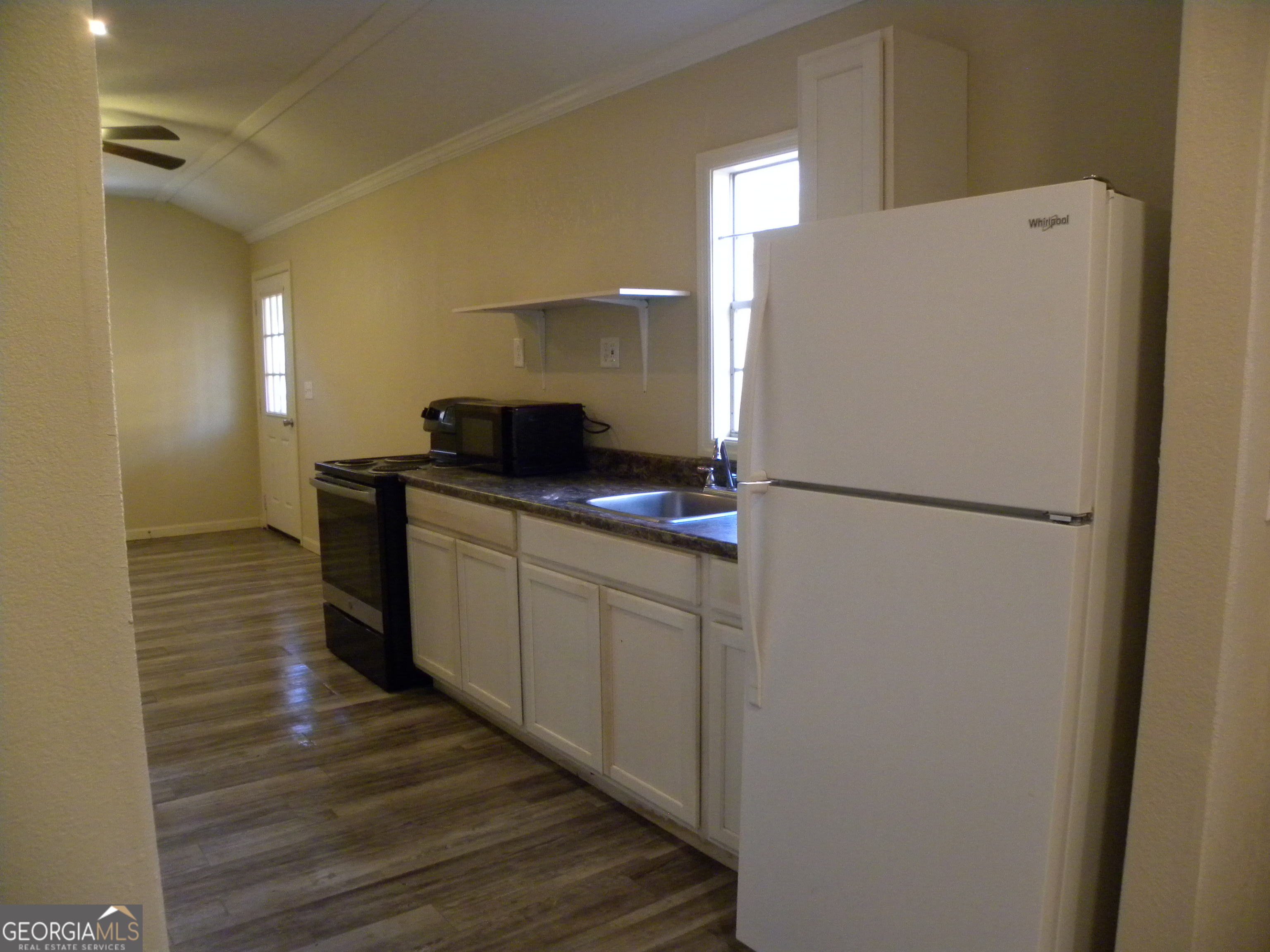 105 West Z Clayton, GA 30562 - Photo 3 of 20 a kitchen with a refrigerator and a sink