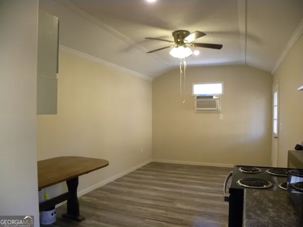 a view of a livingroom with a workspace