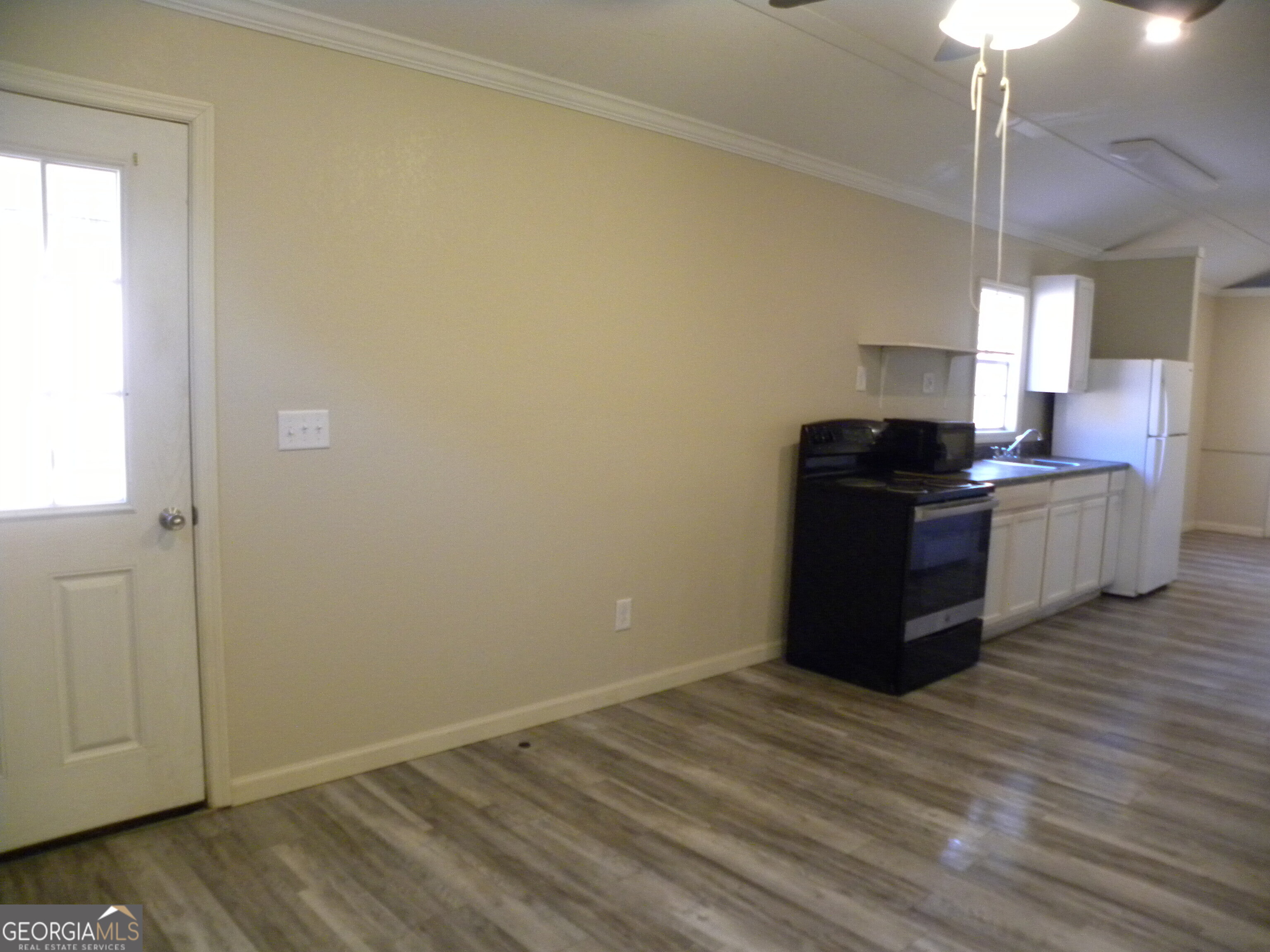 105 West Z Clayton, GA 30562 - Photo 7 of 20 a kitchen with a stove and wooden floor