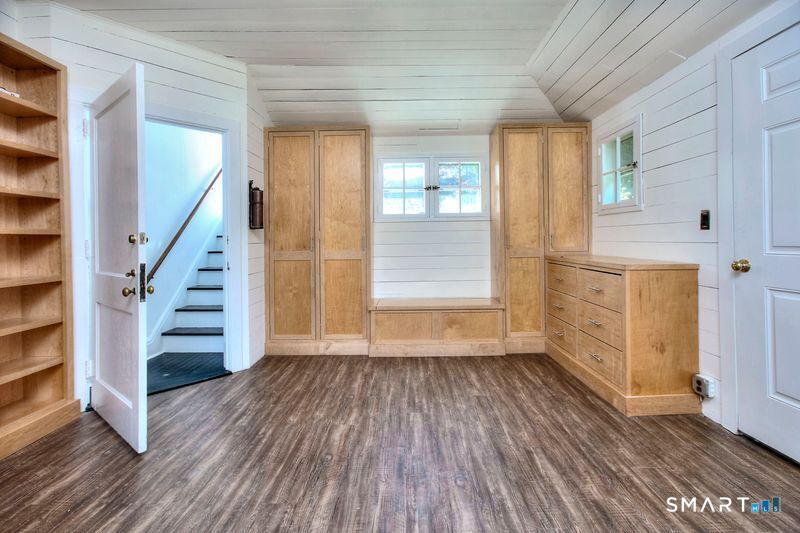 94 Honey Hill Road Wilton, CT 06897 - Photo 3 of 18 wooden floor in an empty room with a window and wooden floor