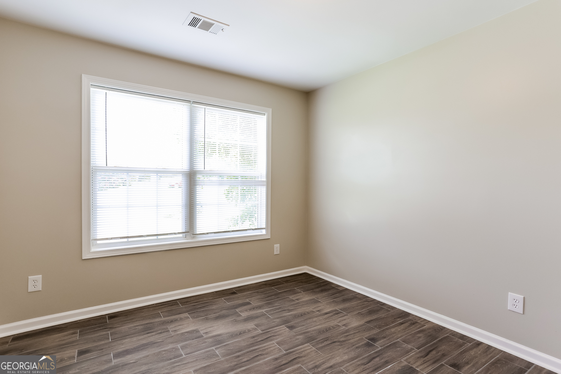 147 Portland Road Aragon, GA 30104 - Photo 11 of 17 an empty room with wooden floor and windows