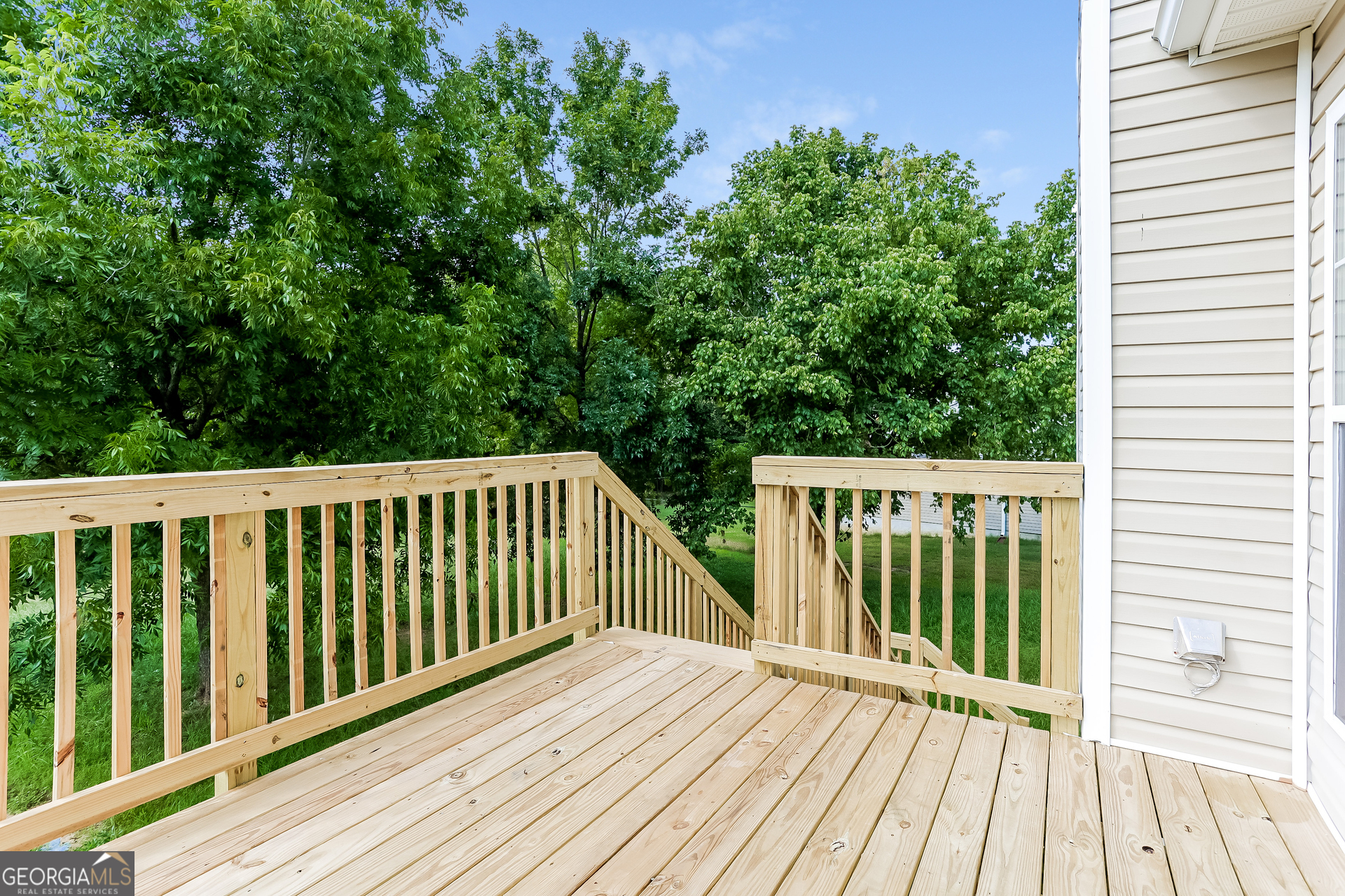 147 Portland Road Aragon, GA 30104 - Photo 15 of 17 a balcony with wooden floor and trees in the background
