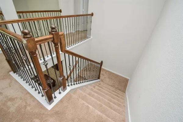 a view of a hallway with staircase