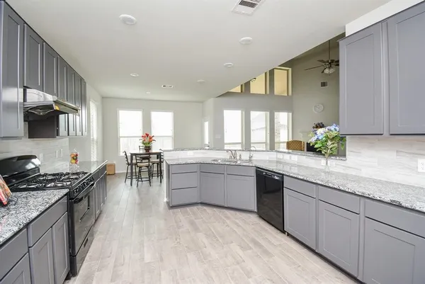 a kitchen with lots of counter top space and appliances