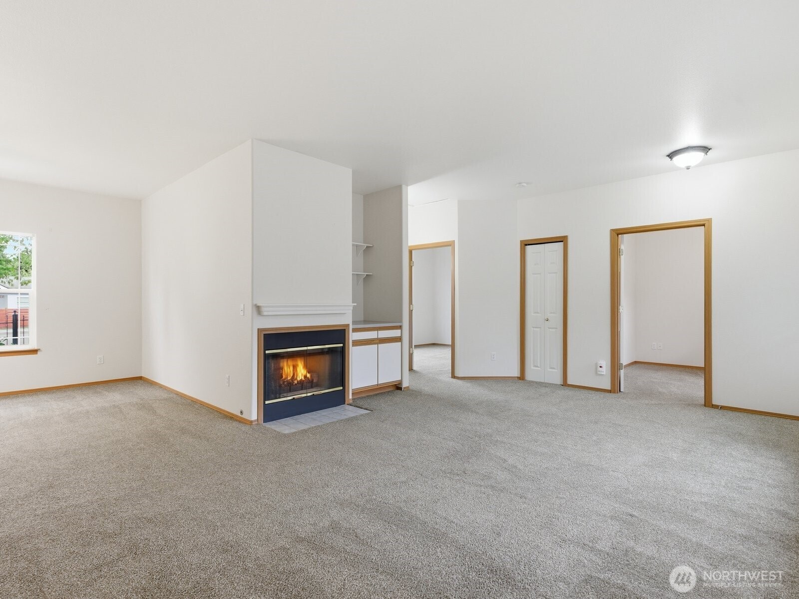 323 North Laventure Road, Unit C Mount Vernon, WA 98273 - Photo 13 of 24 an empty room with windows and fireplace
