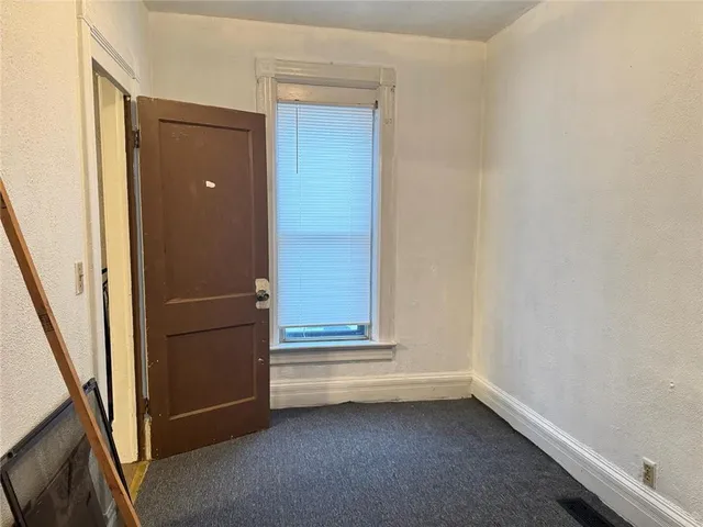 a white toilet sitting next to a bath tub