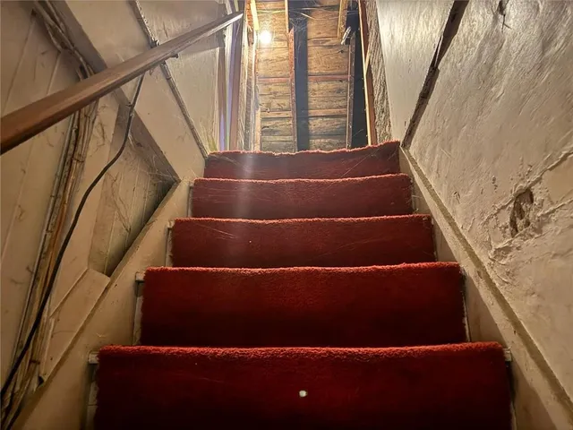 a view of a white house with many windows